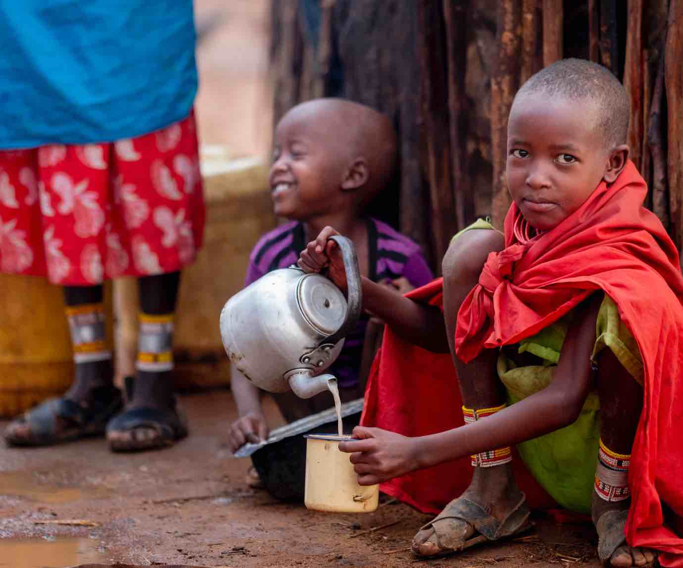 Village children serving milk