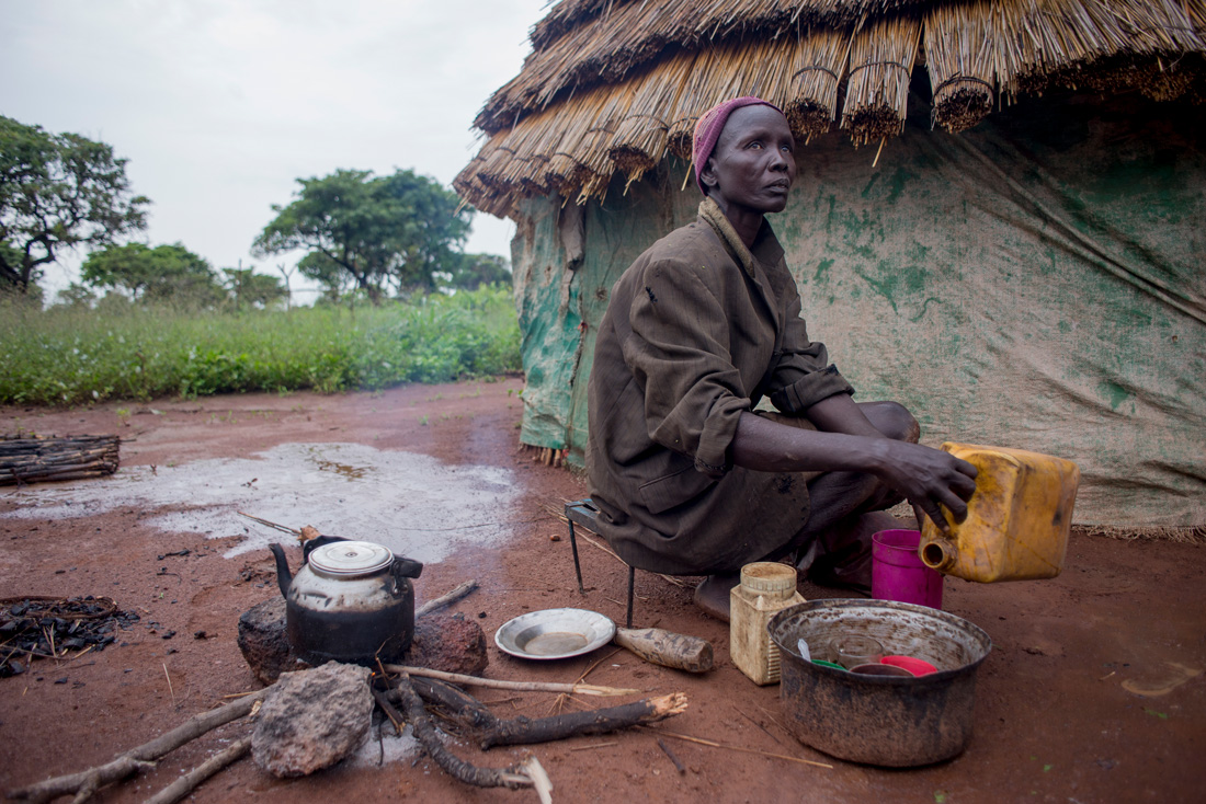 Rebecca outside her hut